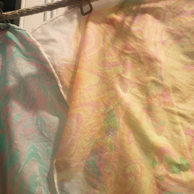 Close-up of patterned silk with a focus on texture and color.