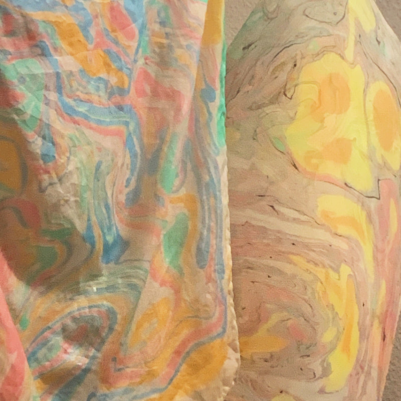 Colorful abstract patterned silk on a hanger