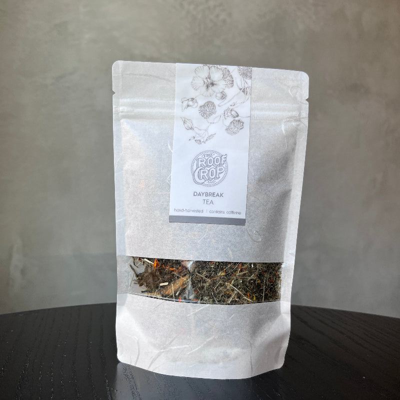 Tea bag with a label on a gray surface