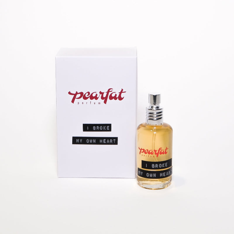 Pearfat parfum bottle and packaging on a white background