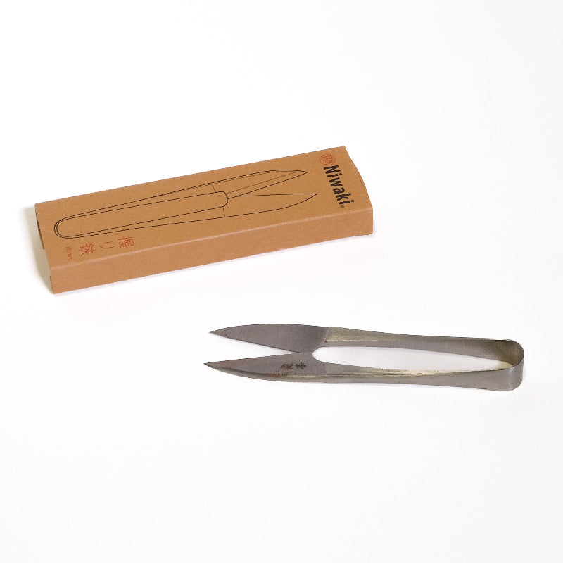 Niwaki mini snips (Metal scissors) with a cardboard box on a white background