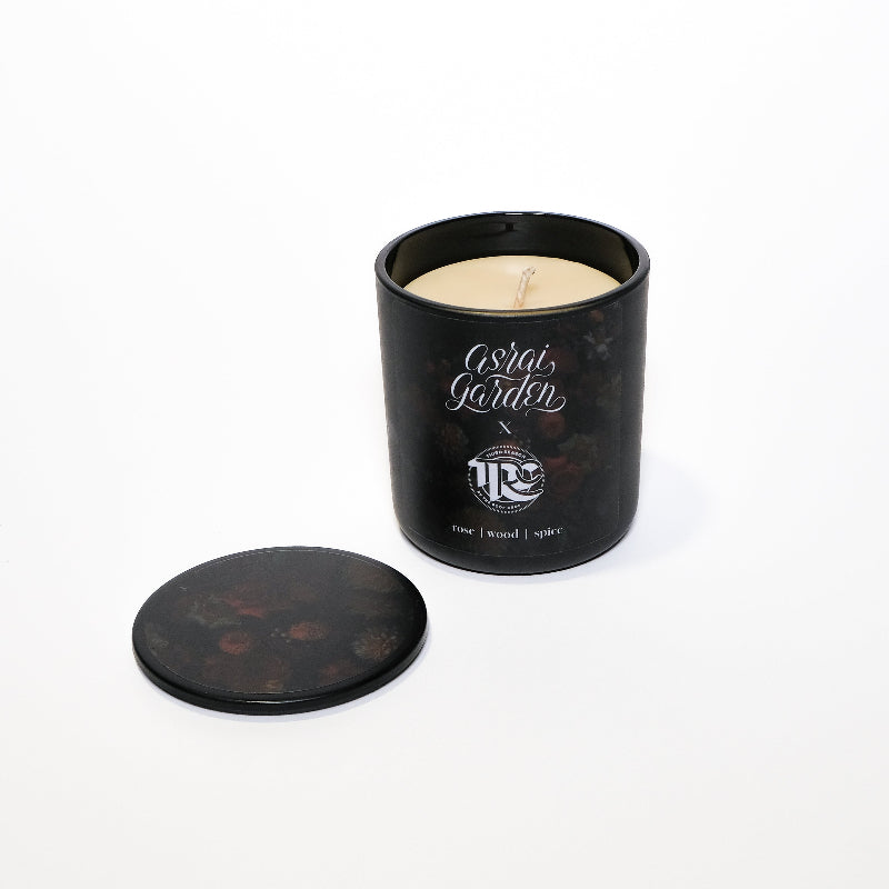 Black candle jar with a lid on a white background