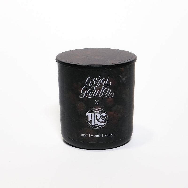 Black candle jar with 'Asrai Garden x Third Season' branding on a white background