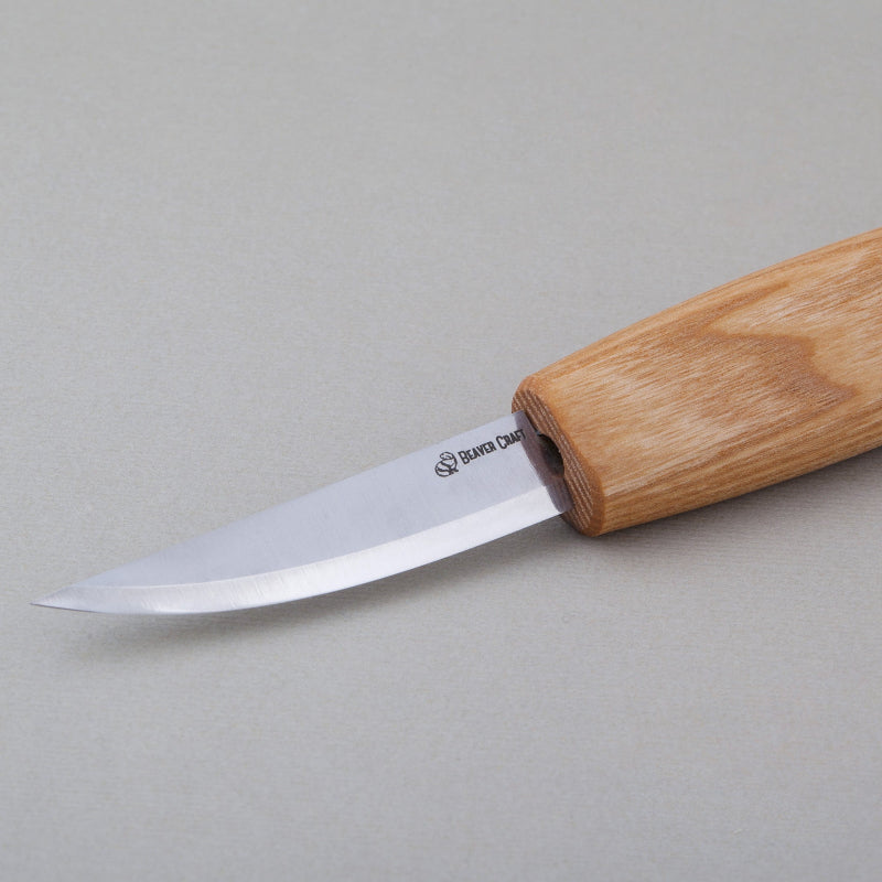 Knife with a wooden handle on a gray background