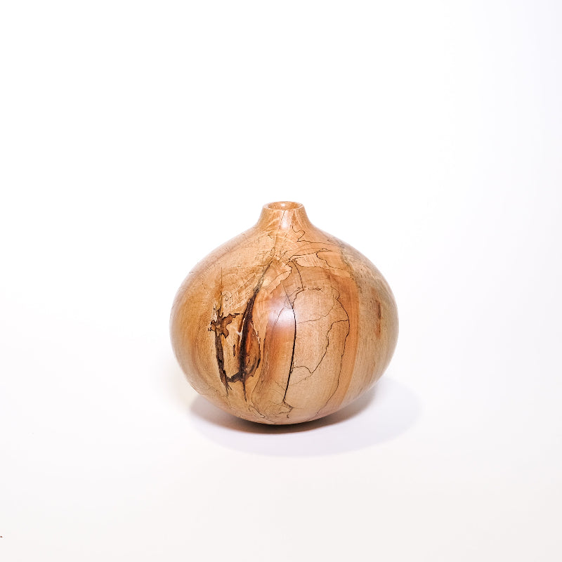 Wooden vase with natural grain patterns on a white background
