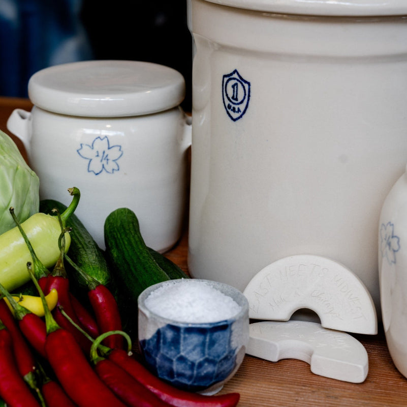 Crock with vegetables on a wooden surface